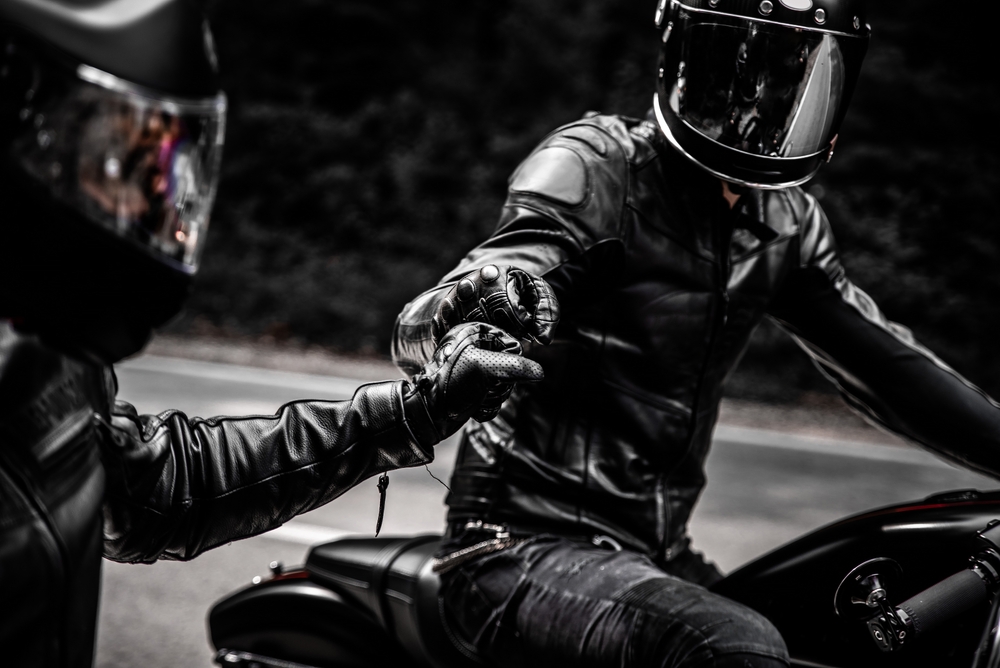 Fist,Bump,Greeting,Of,Two,Motorbike,Riders,In,Leather,Clothes