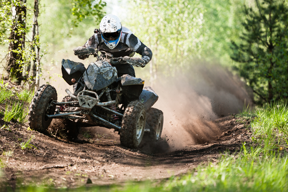 Atv,Rider,Creates,A,Large,Cloud,Of,Dust,And,Debris