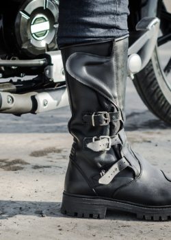 Biker,Leg,In,A,Boot,Against,The,Backdrop,Of,A